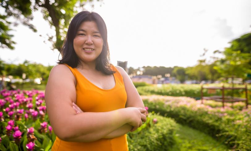 Beautiful overweight Asian woman with arms crossed