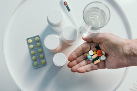 Hand holding pills