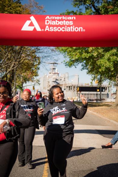 Smiling woman walking at ADA Philadelphia Step Out event